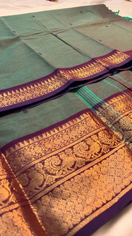 kanchi Cotton dual tone green and purple saree with purple border and blue butta